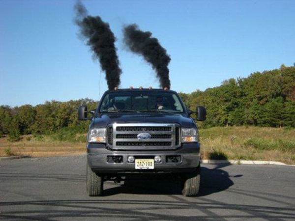 coal roller spewing black smoke