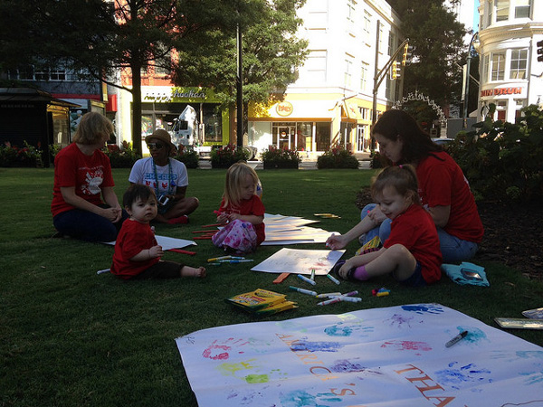 Parents and children creating signs at Atlanta Play-In.