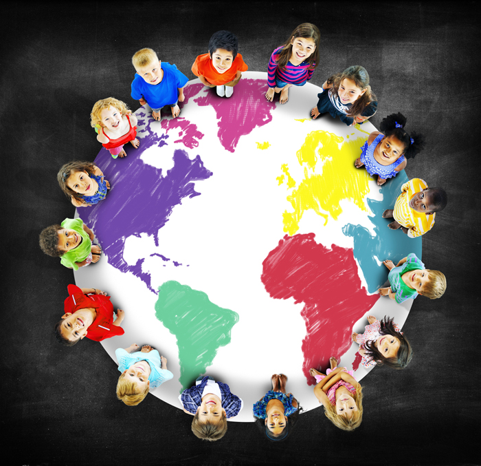 Group of kids standing on globe picture