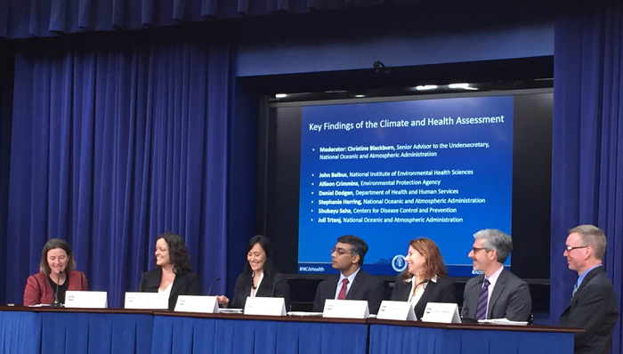Scientists and public officials at the White House discussing the health impacts of climate change.
