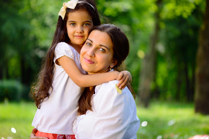 Latino woman with her daughter