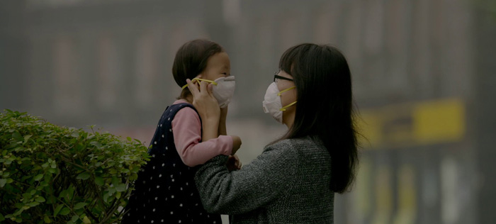 Chinese mother and daughter wearing masks