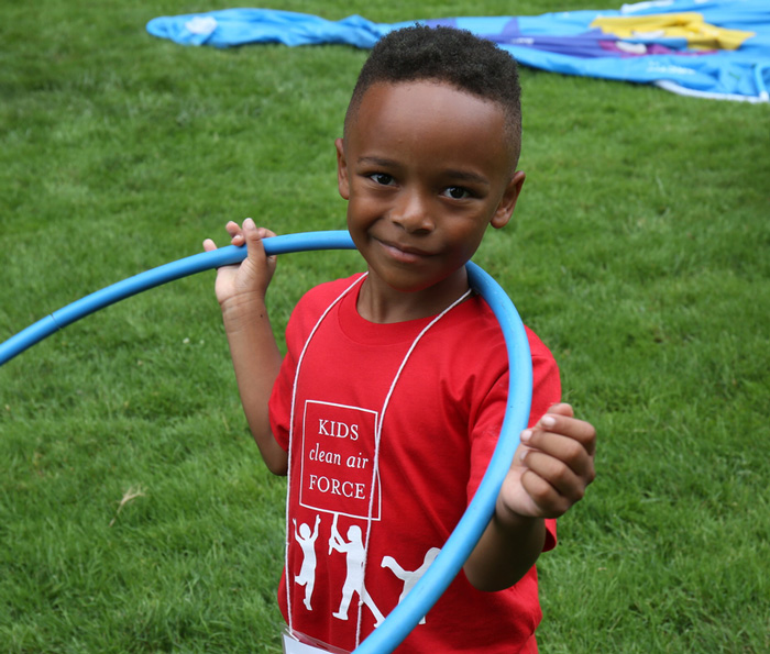 Boy with a hula hoop at the play-in for climate action