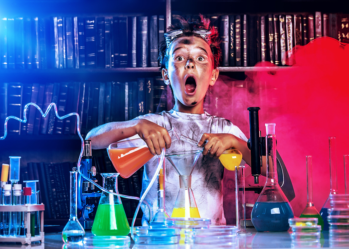Boy doing colorful science experiment