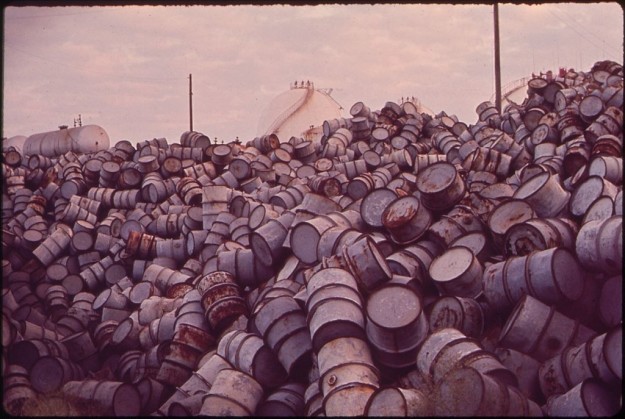 Huge pile of damaged oil barrels