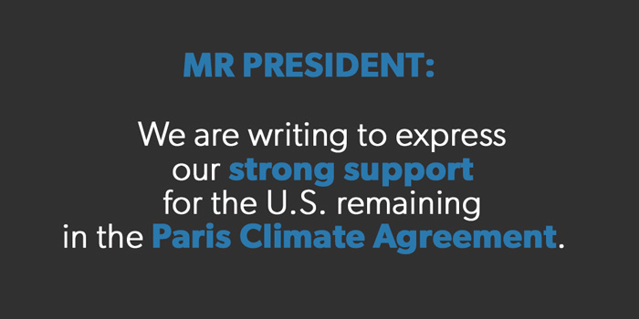 Placard reading: Mr. President: We are writing to express our strong support for the U.S. remaining in the Paris Climate Agreement