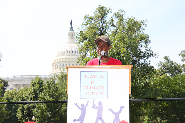 Victoria Barrett, one of the plaintiffs from Our Children's Trust, a landmark youth lawsuit suing the government for a "stable climate and healthy atmosphere" speaks at the play-in for climate action