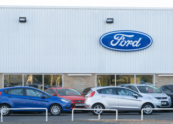 Car companies, like this Ford dealership, are not living up to their clean air promises.