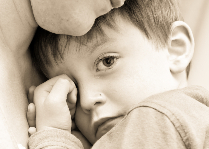 child with tear in his eye