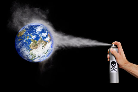 toxic chemicals being sprayed on a globe