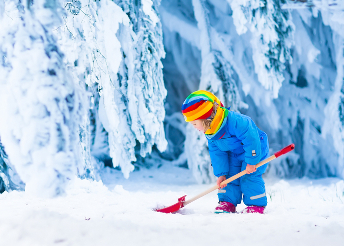 child shoveling snow