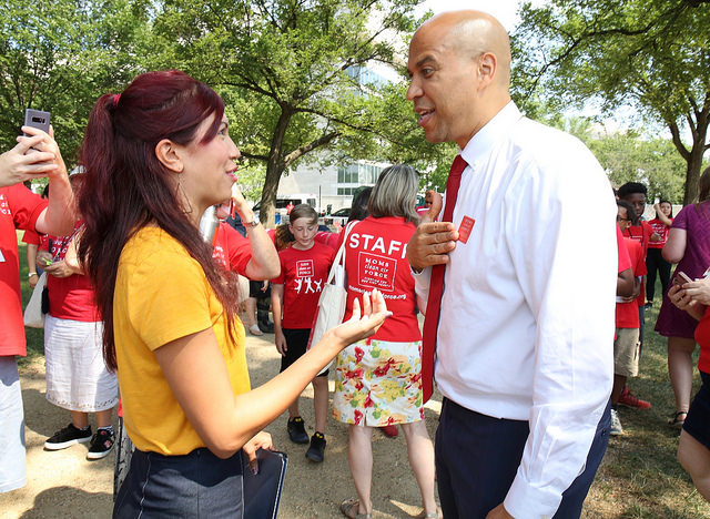 Moms Clean Air Force member, Kristin Mink talking with Sen. Cory Booker. Talk to your politicians about climate change
