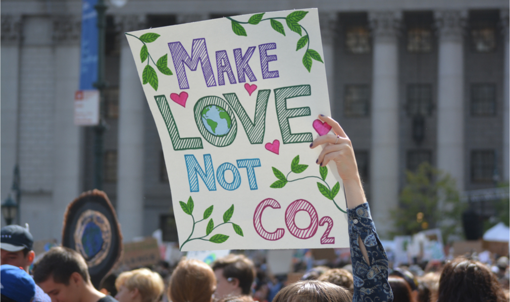 Make Love Not CO2 sign seen at the climate strike