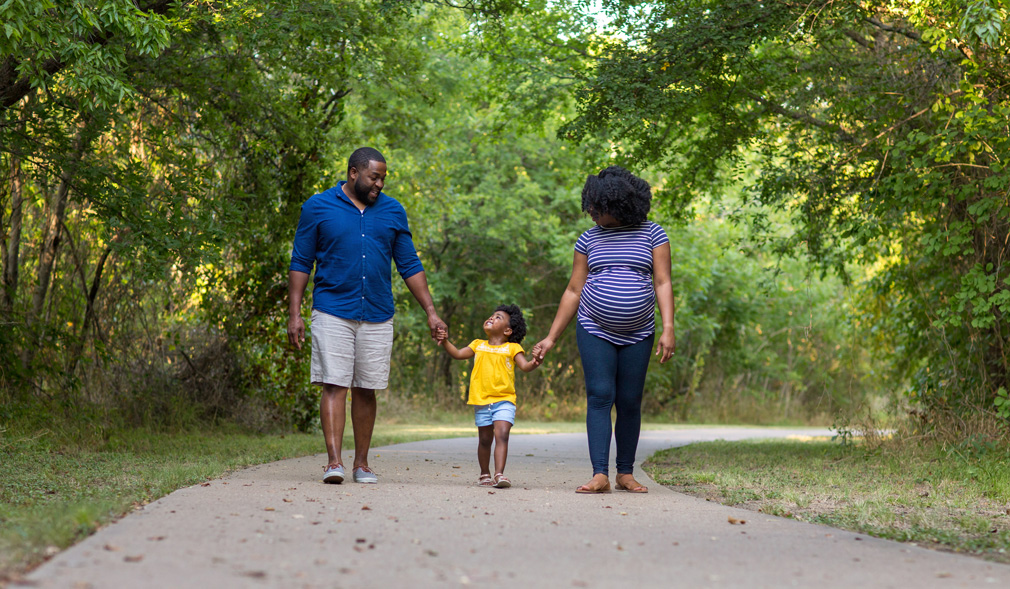 Most African American families, like these parents and their child, support 100% clean economy
