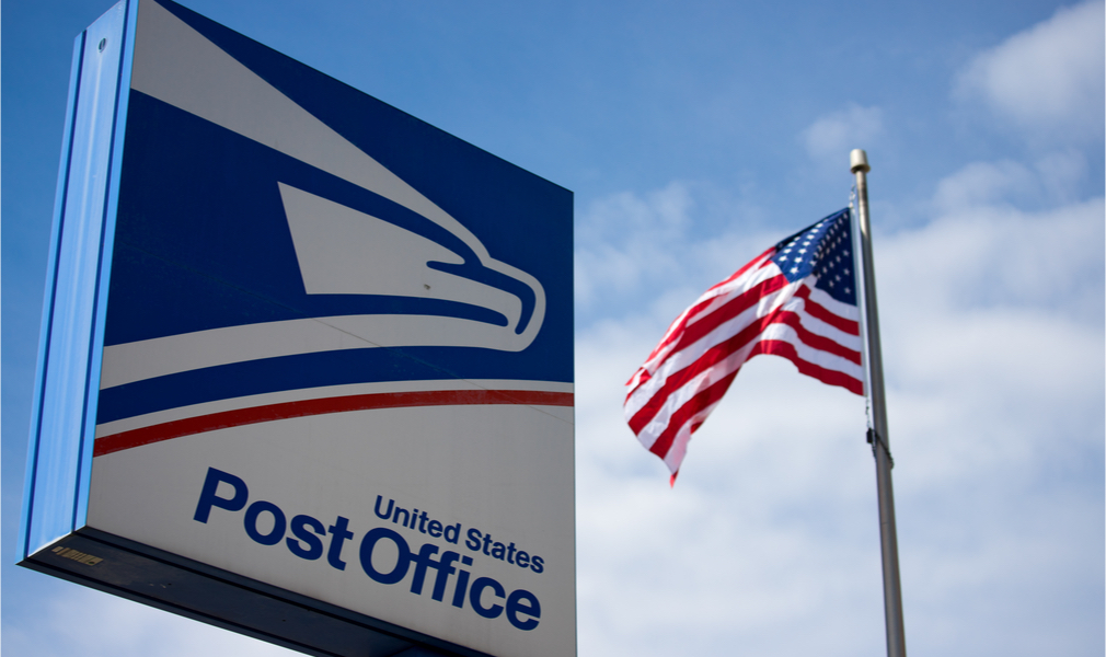 post office sign and American flag