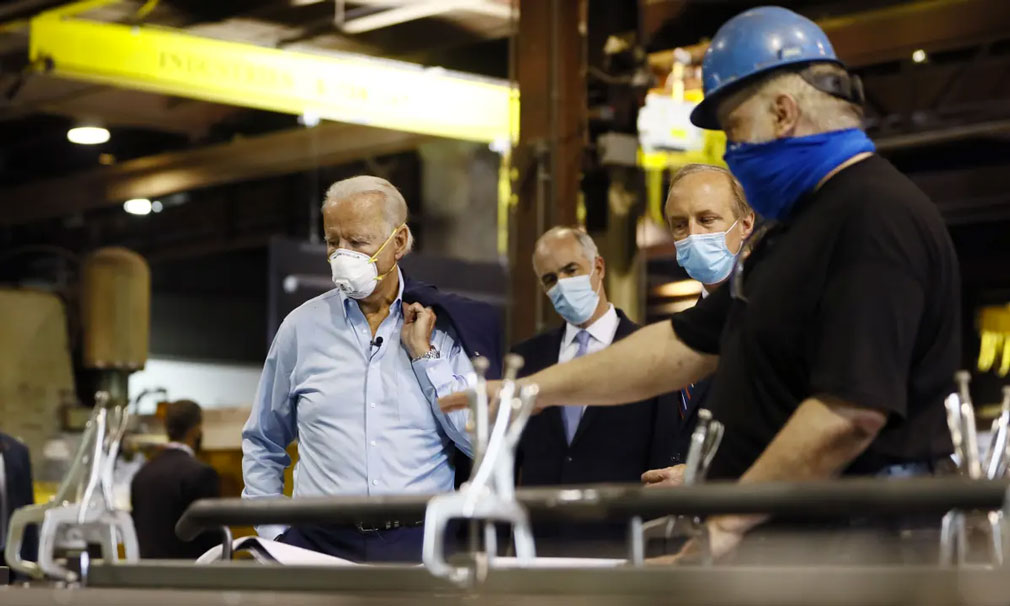 President Joe Biden touring a factory, he recently presented the new American Jobs Plan