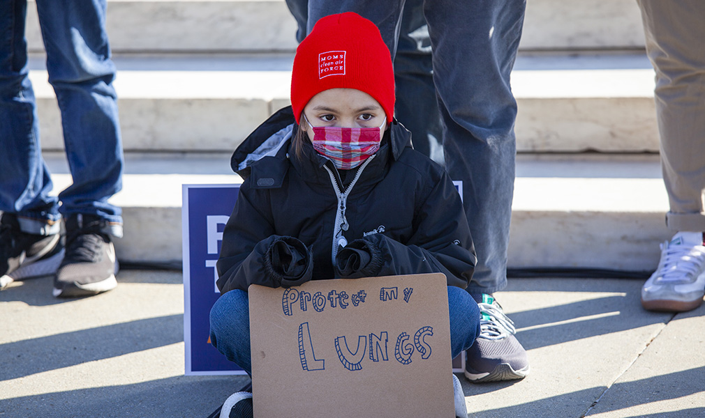 Child with sign asking EPA to protect their lungs