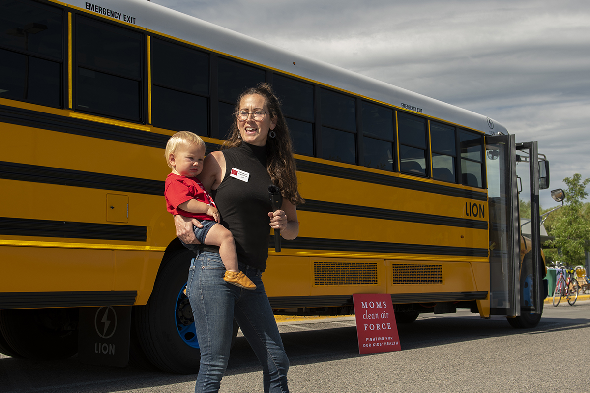 Michelle and her son advocate for electric school buses at an event in Montana, June 2021.