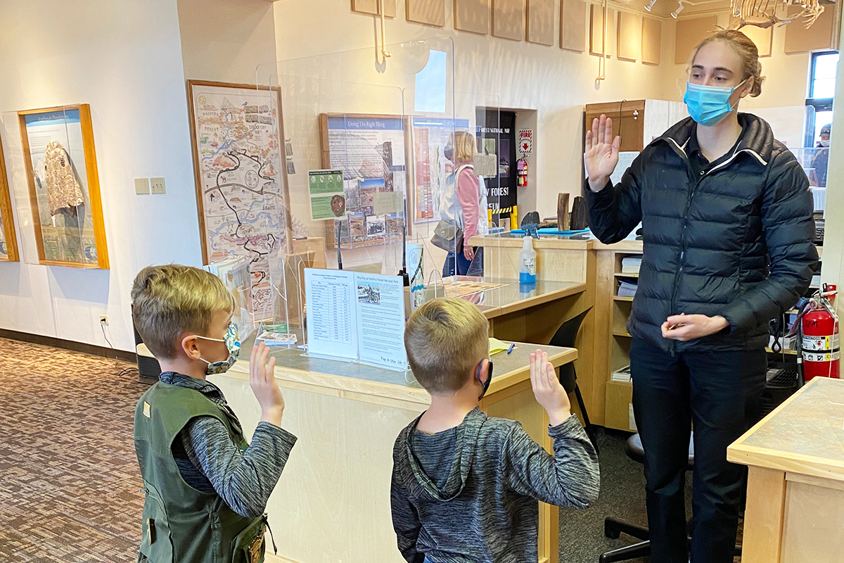 Boys take the Junior Ranger Pledge at the Visitors Center at Petrified Forest National Park in Arizona
