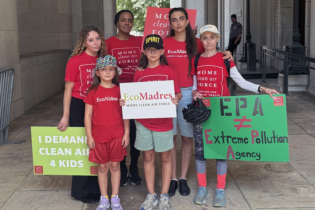 Moms Clean Air Force members holding signs