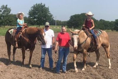 Connie, her husband, and their granddaughters