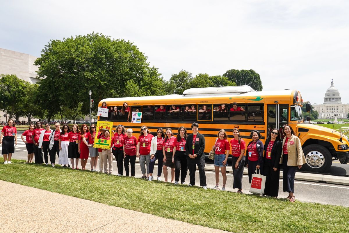 Moms Clean Air Force by a school bus