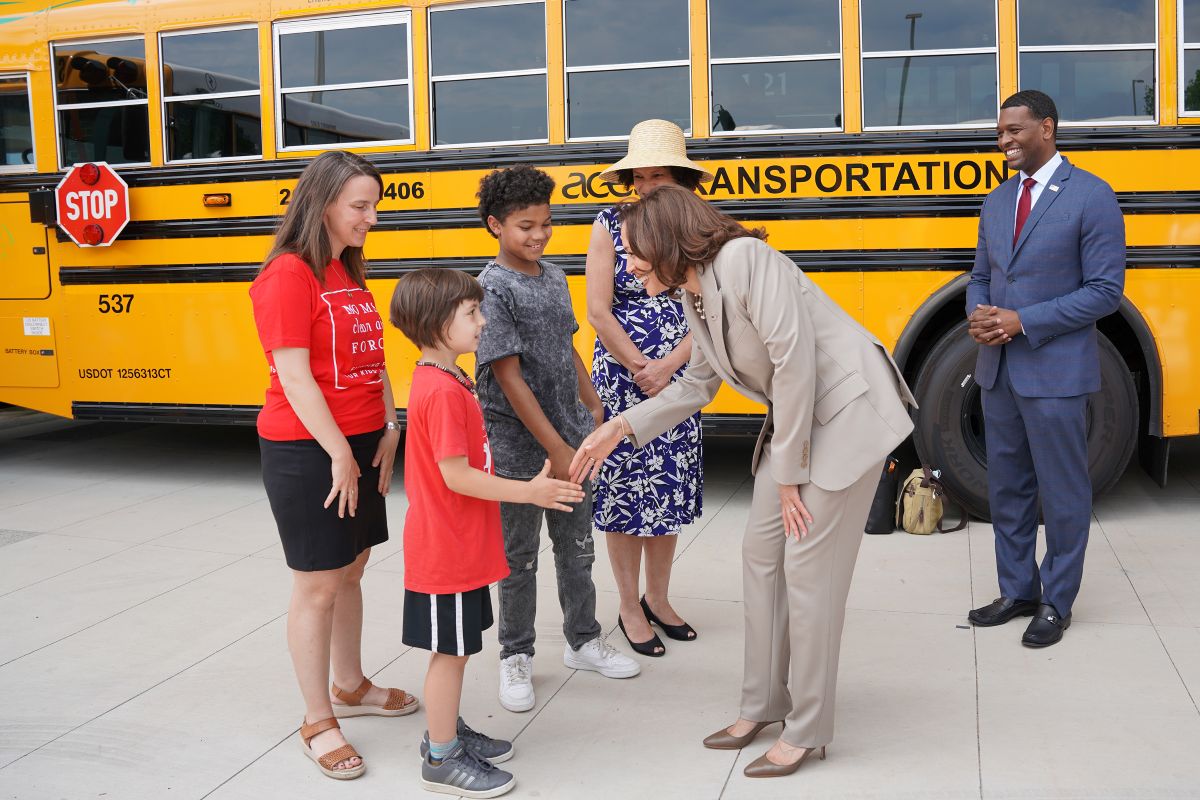 VP Kamala Harris meets Moms and kids near an electric school bus