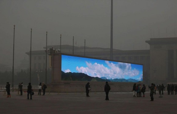 Photo of a screen displaying clear air floating in a fog of Beijing air pollution 