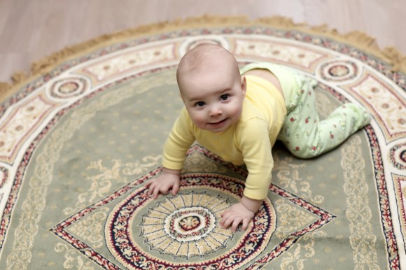 Aa baby crawling on a carpet