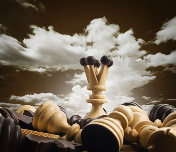 Giant chess set with clouds in the background