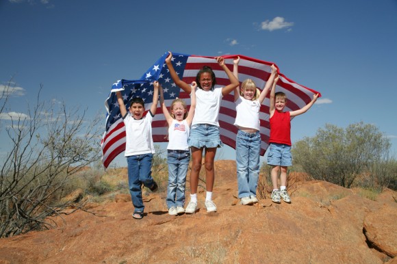 Group of children holding American flag