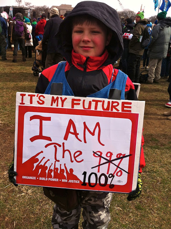 Young man holding sign at Washington climate march