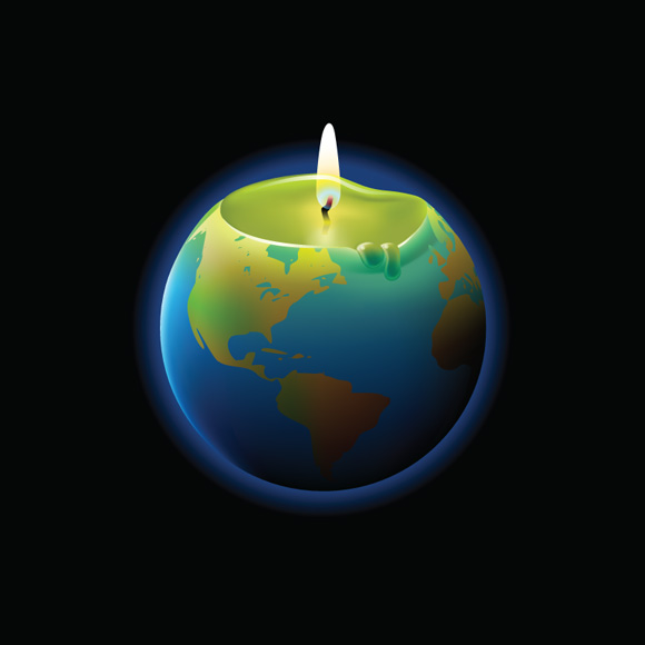 a lit candle that looks like earth