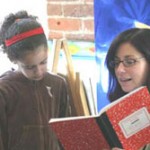 Teacher reading to a student