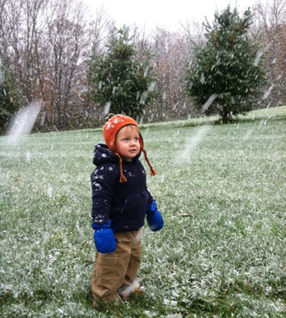 Little boy standing in the snow